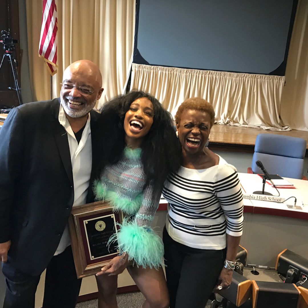 A photo of SZA with her parents