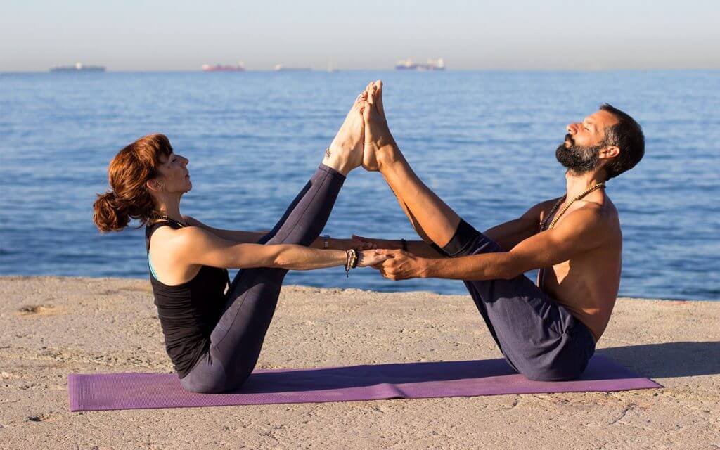 Partners Practicing Yoga Together 